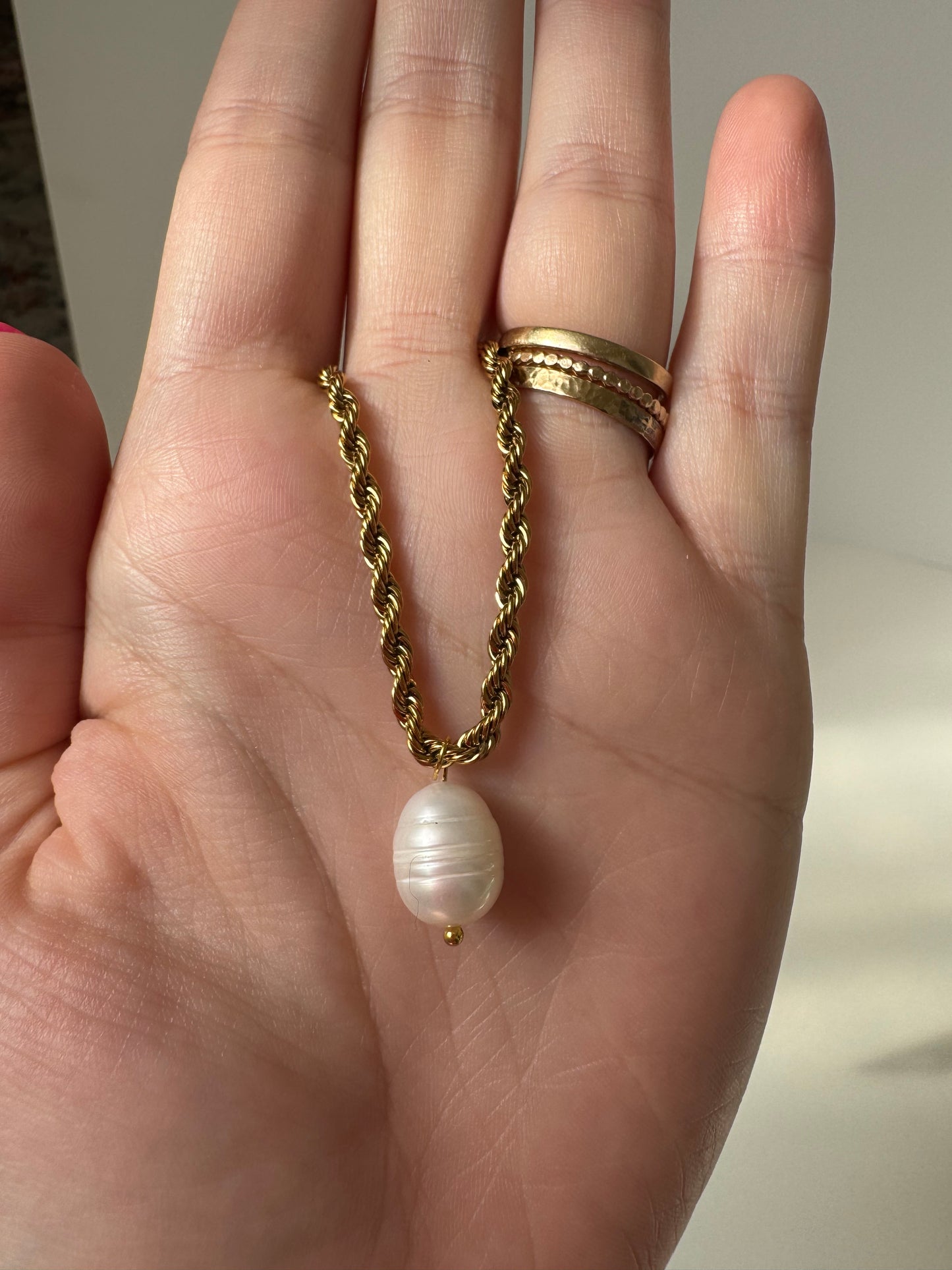 Gold braided chain and pearl